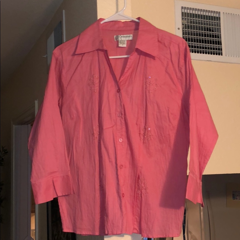 Women’s pink button-down shirt